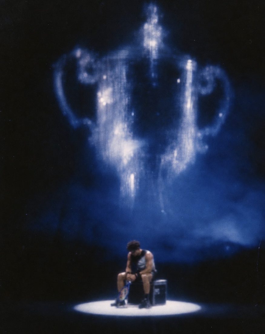 AI-generated image: a trophy made of light floating above a player sitting alone in a spotlight